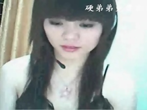 Adorable Asian teases her tits on webcam