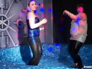 Curvy girls in wet look leggings dancing in club