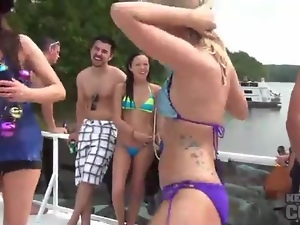 Girls in bikinis eat pussy on party boat