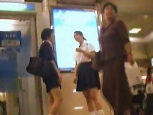Upskirt view of asian schoolgirls