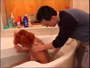 Redheaded Granny Fucked in Bath