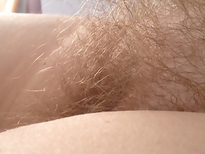 pulling on the wifes long hairy pussy pubes