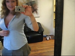 Busty girl next door Andy Lynn takes picture of herself in the mirror