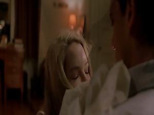 Jacinda Barrett nude as she lays on top of a guy in bed,