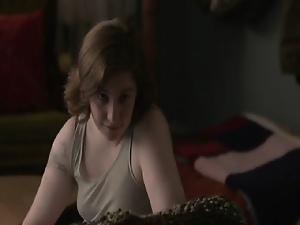 Lena Dunham lying naked on her back in bed as a guy sleeps