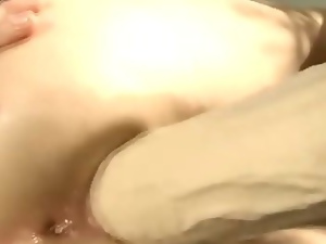 Sexy blonde gets huge dildo in her loose pussy