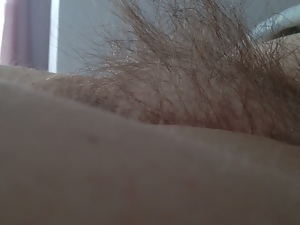 side view of the wifes tall long hairy pussy
