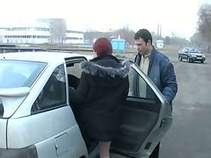 Redhead student sucks on the banks of the river for all to see