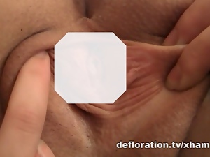 Redheaded teen shows virgin pussy