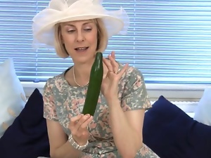 Mature housewife fucks a cucumber