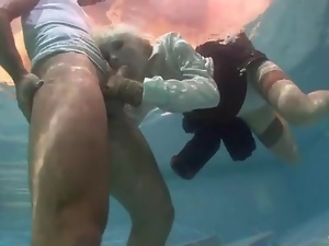 Blonde chick sucks hard dick underwater