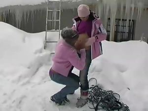 Lesbian snow bunnies in sweaters outdoors