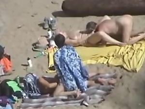 Girl gets her pussy fingered by her husband on a nude beach