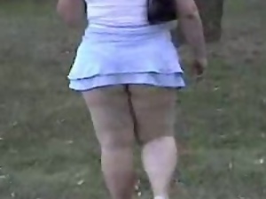 Chubby girl in extremely short skirt gets caught on a spy cam