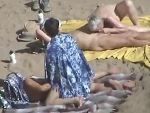 Kinky couple doesn't feel shy while making love on a nude beach