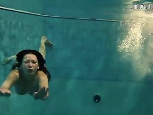 Underwater with bikini swimming girls