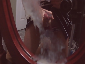 Spraying cum on a mirror