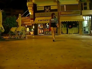 a short public walk at night in ballet heels