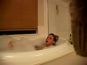 Horny blond is rubbing her cunt in the bathtub
